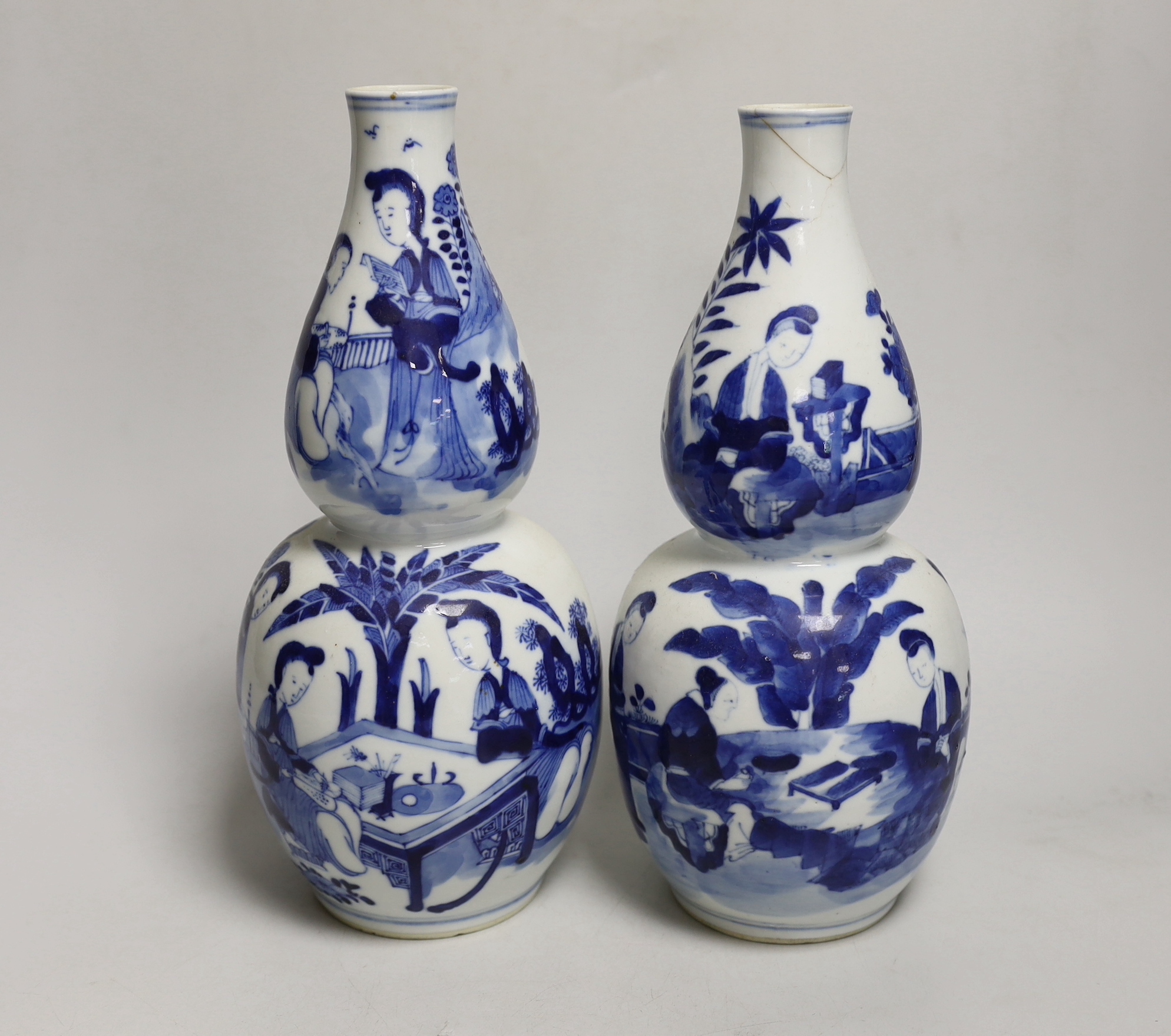 A pair of 19th century Chinese blue and white double gourd vases, 26cm high (a.f.)